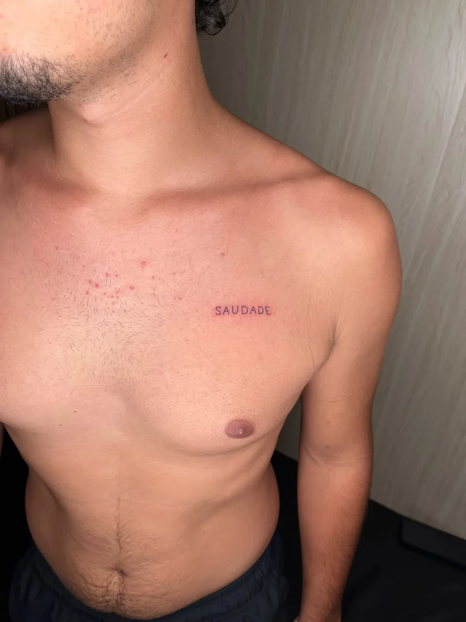 man chest small lettering minimalist fine line line work line tattoo canggu bali