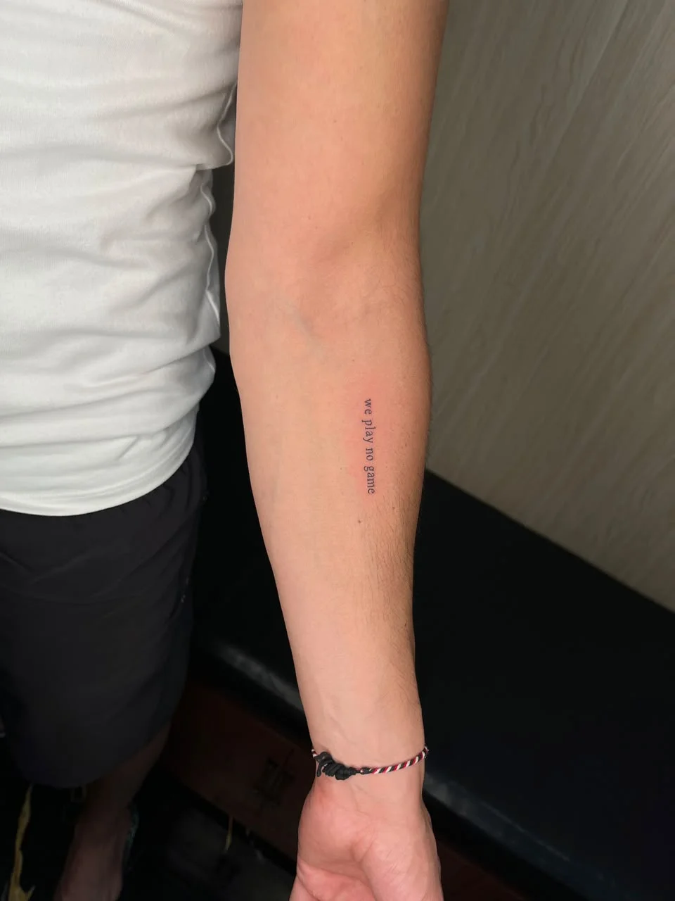 man hand small lettering minimalist fine line line work line tattoo canggu bali