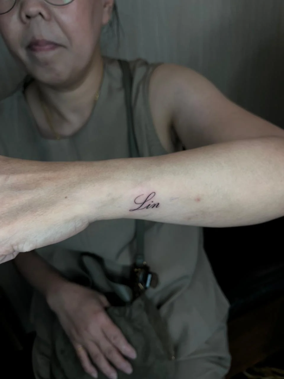 woman small lettering minimalist fine line line work line tattoo canggu bali