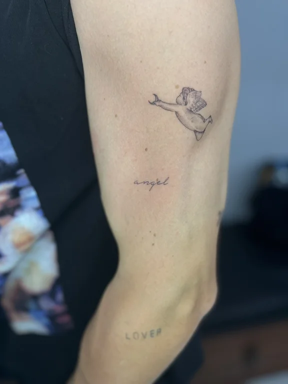animal minimalist angel soft shading elegant fine line minimal linework tattoo Canggu Bali