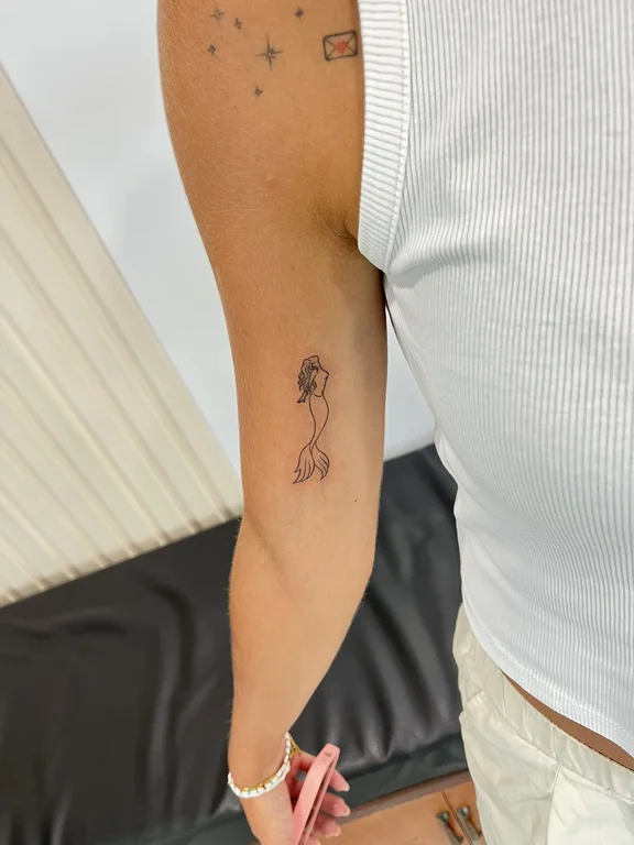 abstract minimalist woman fine line minimal linework wave elegant tattoo Canggu Bali