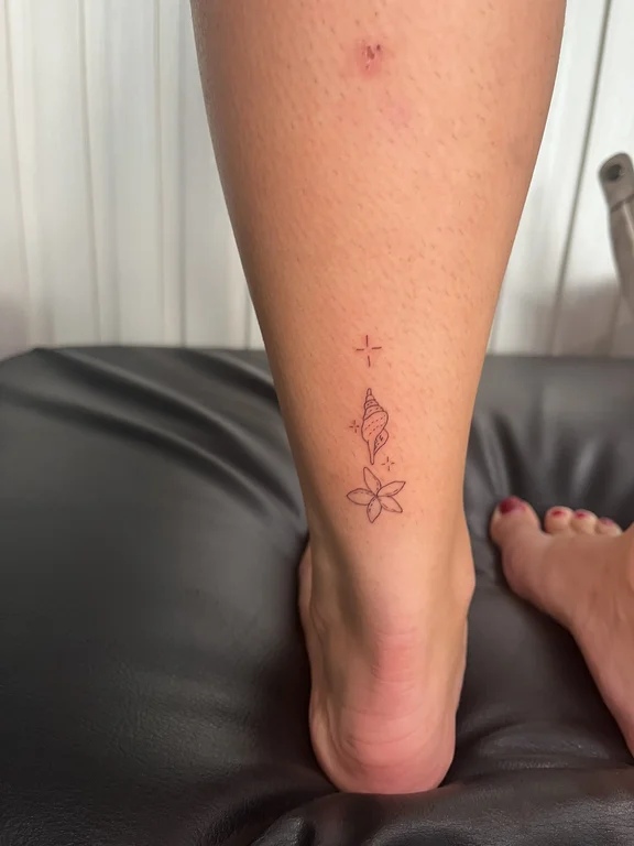 symbol fine line deity dotwork spiritual minimal linework elegant tattoo Canggu Bali