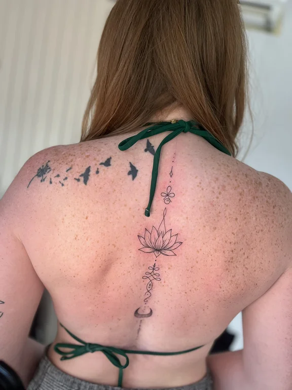 nature minimalist lotus dotwork spiritual elegant linework fine line tattoo Canggu Bali
