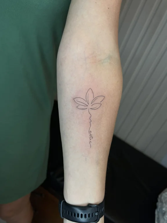 nature minimalist lotus fine line minimal leaf linework soft shading tattoo Canggu Bali