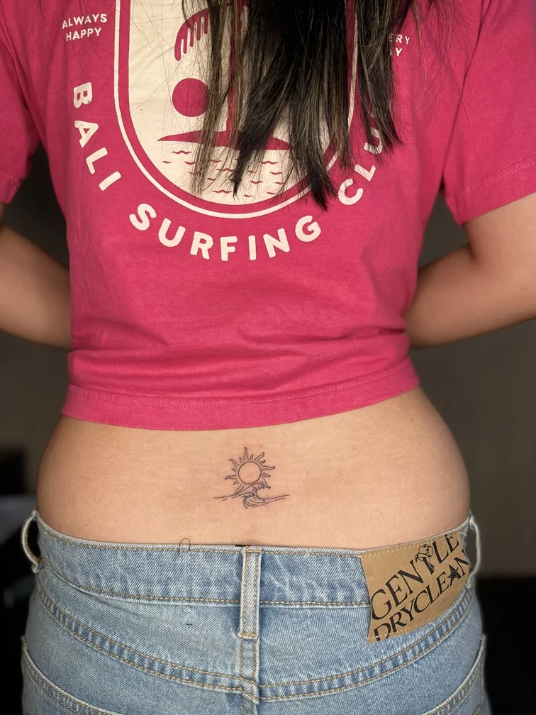 wave sun beach minimalist nature woman back black line linework tattoo tattoo canggu bali