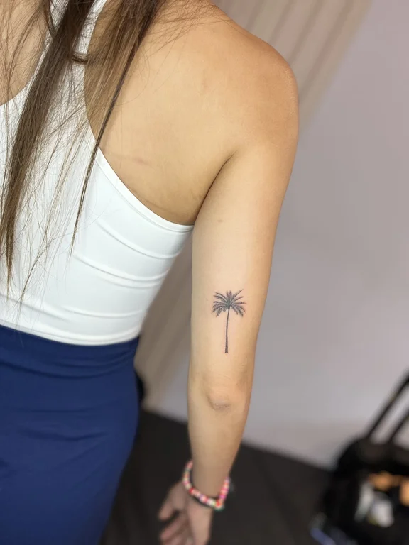 nature minimalist woman fine line minimal elegant soft shading leaf tattoo Canggu Bali