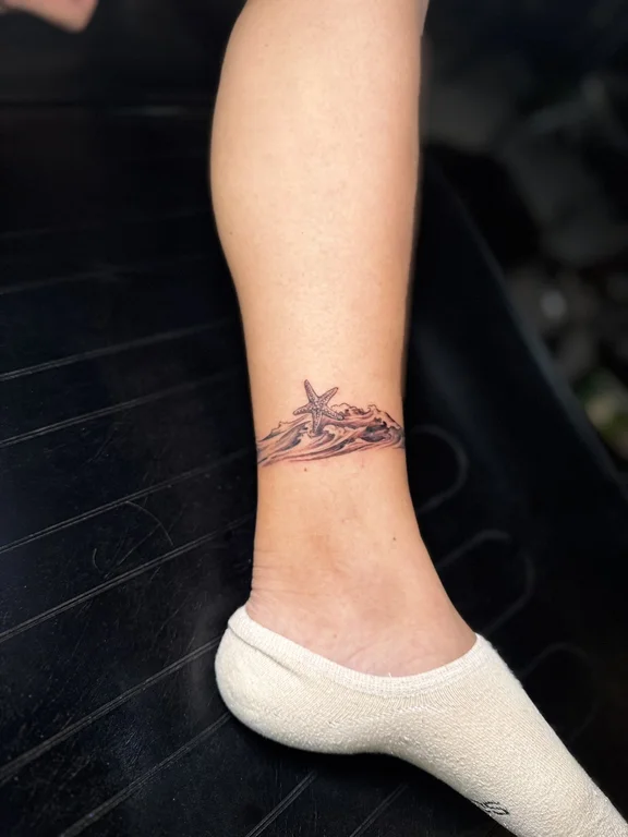 nature minimalist woman fine line wave elegant soft shading linework tattoo Canggu Bali