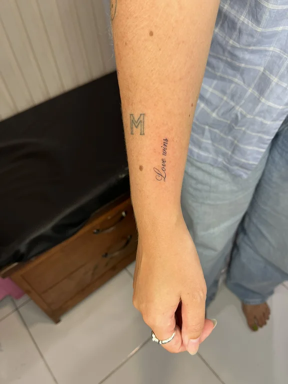 religious minimalist butterfly fine line minimal soft shading spiritual colorful tattoo Canggu Bali