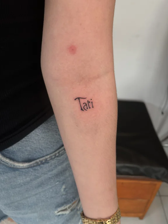 religious minimalist woman fine line minimal spiritual bold line elegant tattoo Canggu Bali