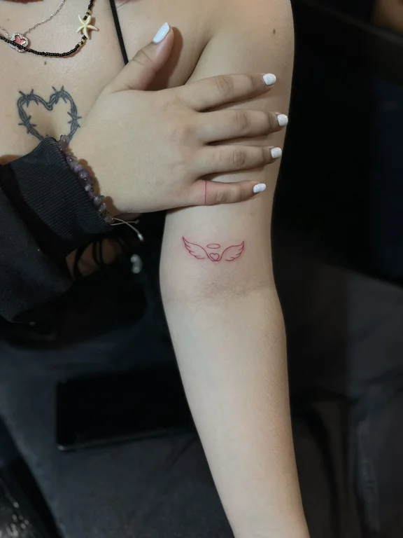 symbol minimalist angel fine line elegant minimal soft shading dotwork tattoo Canggu Bali