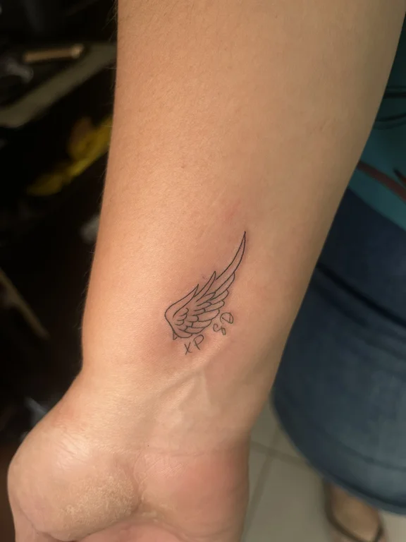 symbol minimalist angel fine line minimal soft shading elegant dotwork tattoo Canggu Bali