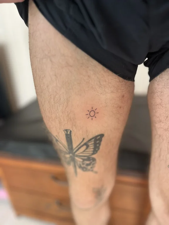 symbol minimalist butterfly dotwork sun minimal soft shading fine line tattoo Canggu Bali
