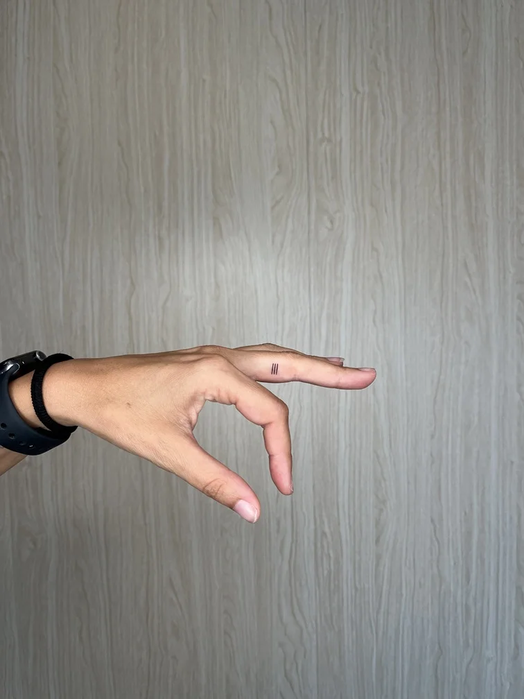 woman finger hand symbol minimalist small fineline fine line linework line tattoo tattoo canggu bali