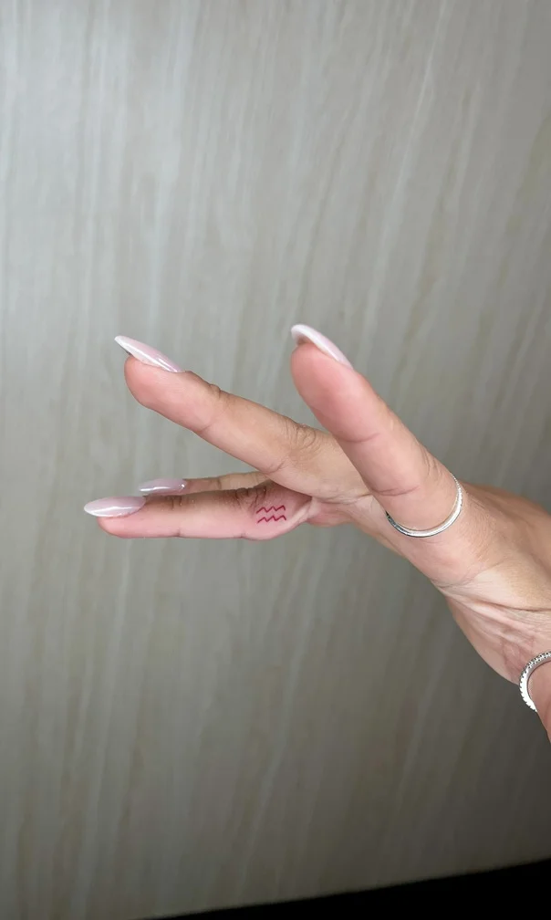 woman finger symbol minimalist fine line fineline linework line tattoo canggu bali