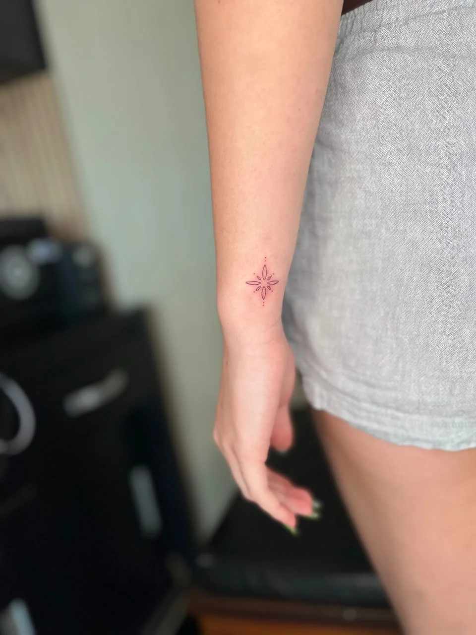 woman hand small symbol minimalist sun fine line line work line tattoo canggu bali