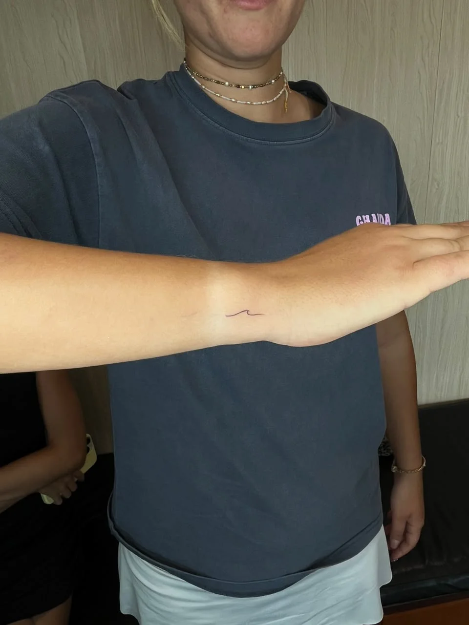 woman hand small wave minimalist symbol fine line line work line tattoo canggu bali