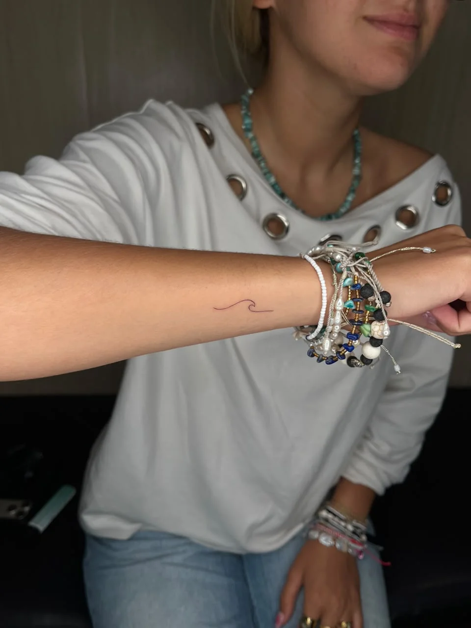 woman hand small wave minimalist symbol fine line line work line tattoo canggu bali
