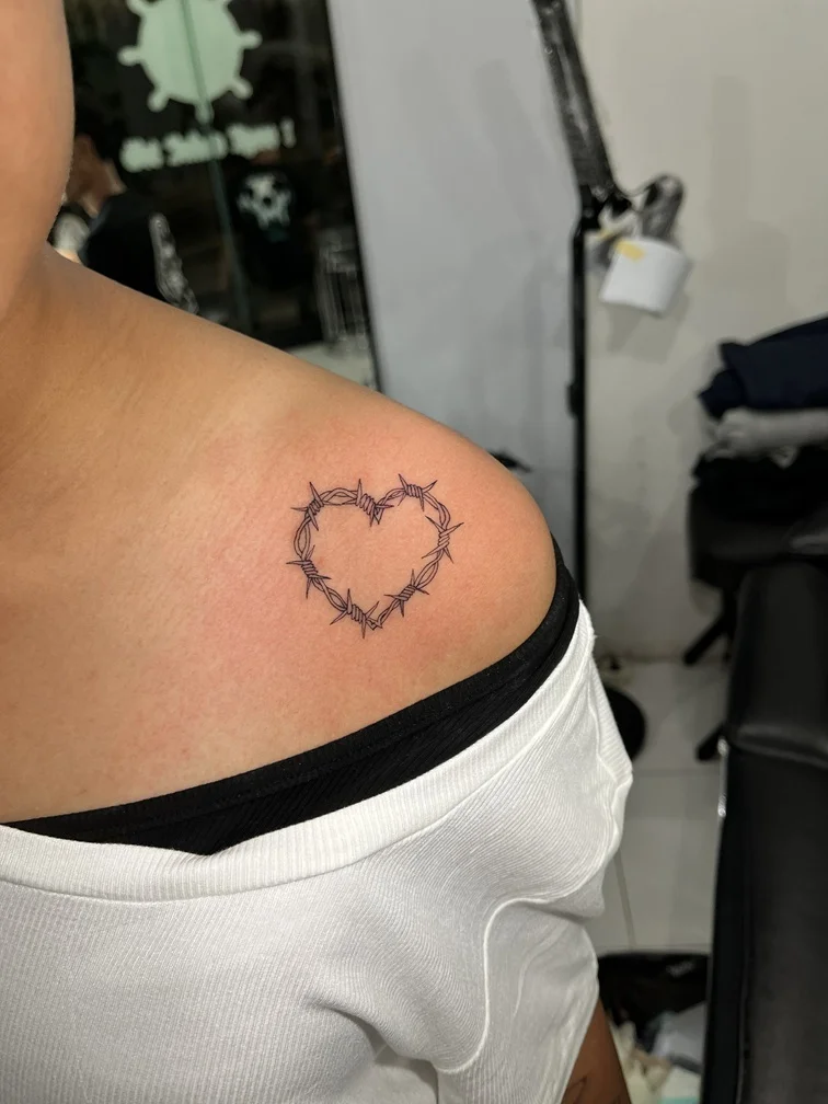 woman shoulder thorn love minimalist symbol black grey tattoo canggu bali