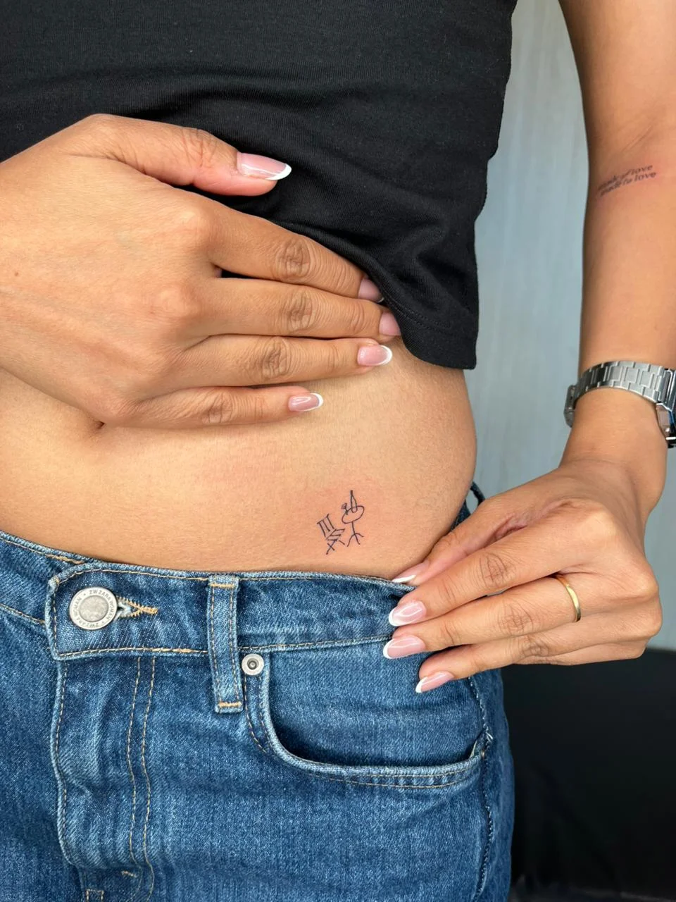woman waist minimalist symbol small fine line line work line tattoo canggu bali