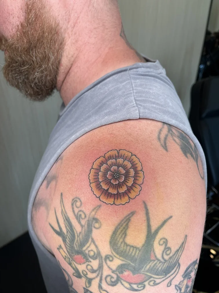flower marigold man shoulder neo traditional tattoo colorful tattoo canggu bali