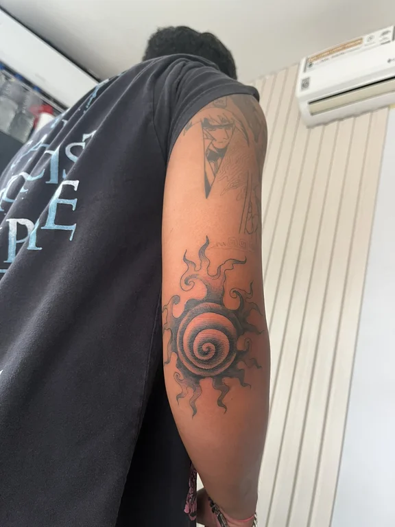 abstract new school deity black grey sun fire cloud heavy shading tattoo Canggu Bali