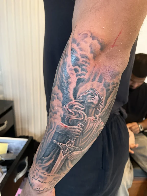 mythology new school angel heavy shading cloud smoke fire black grey tattoo Canggu Bali