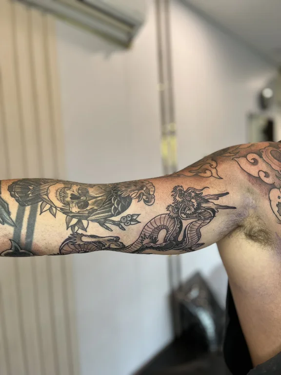 mythology new school deity linework cloud heavy shading black grey man tattoo Canggu Bali