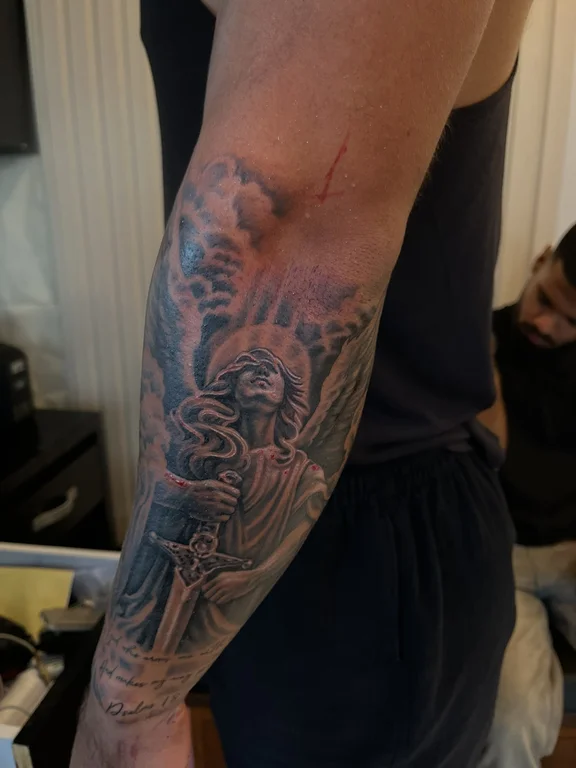 religious new school angel black grey fire cloud smoke heavy shading tattoo Canggu Bali