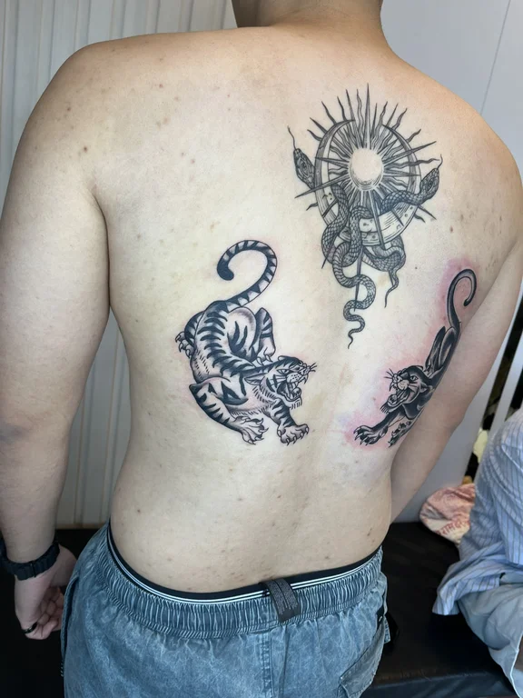 religious new school snake black grey sun dotwork deity demon tattoo Canggu Bali