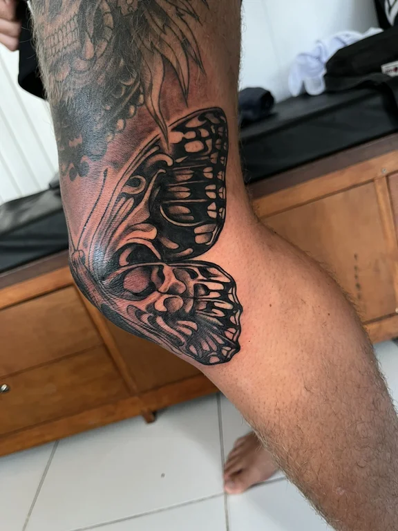 skull new school butterfly black grey fire heavy shading mask linework tattoo Canggu Bali
