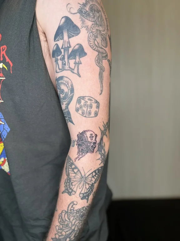 skull new school snake black grey cloud linework heavy shading horror tattoo Canggu Bali