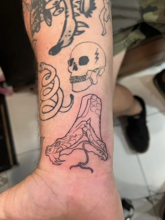 skull new school snake linework horror bold line fine line black grey tattoo Canggu Bali