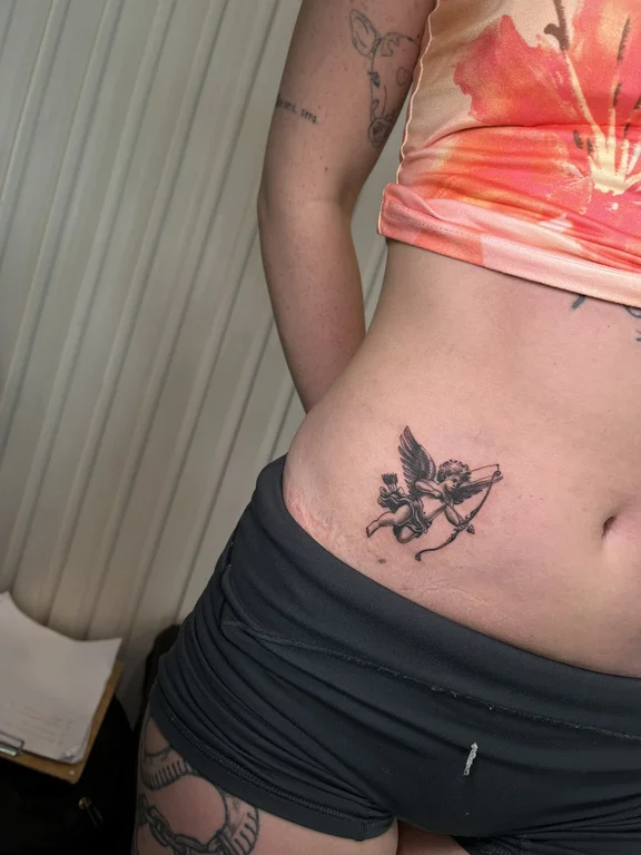 symbol new school angel soft shading cloud fire fine line woman tattoo Canggu Bali