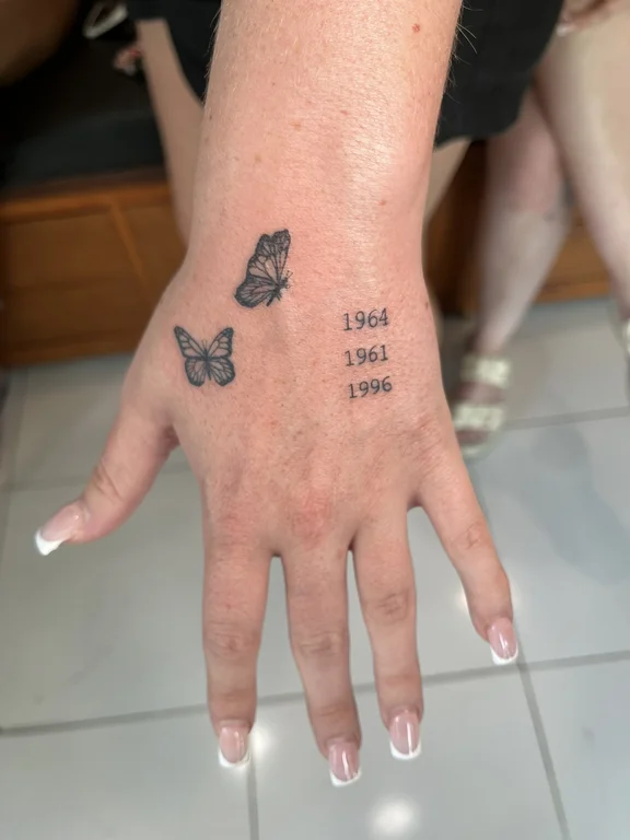 symbol new school butterfly black grey spiritual hand soft shading fine line tattoo Canggu Bali