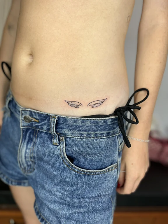symbol new school butterfly fine line wave minimal elegant bold line tattoo Canggu Bali