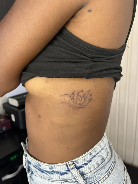 symbol new school lotus fine line wave linework soft shading dotwork tattoo Canggu Bali