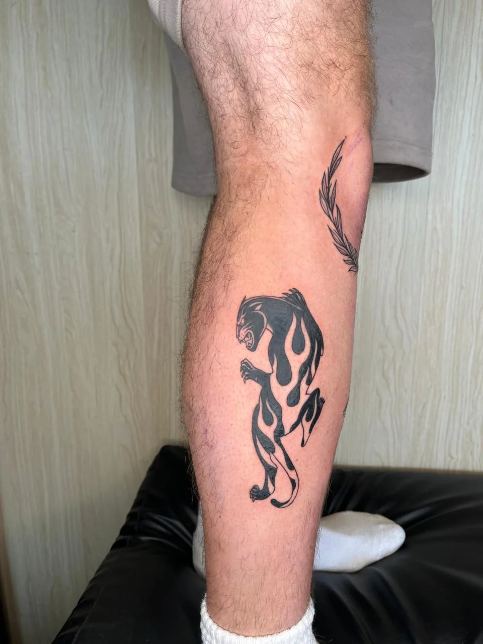 man leg foot tiger old school animal black fire tattoo canggu bali