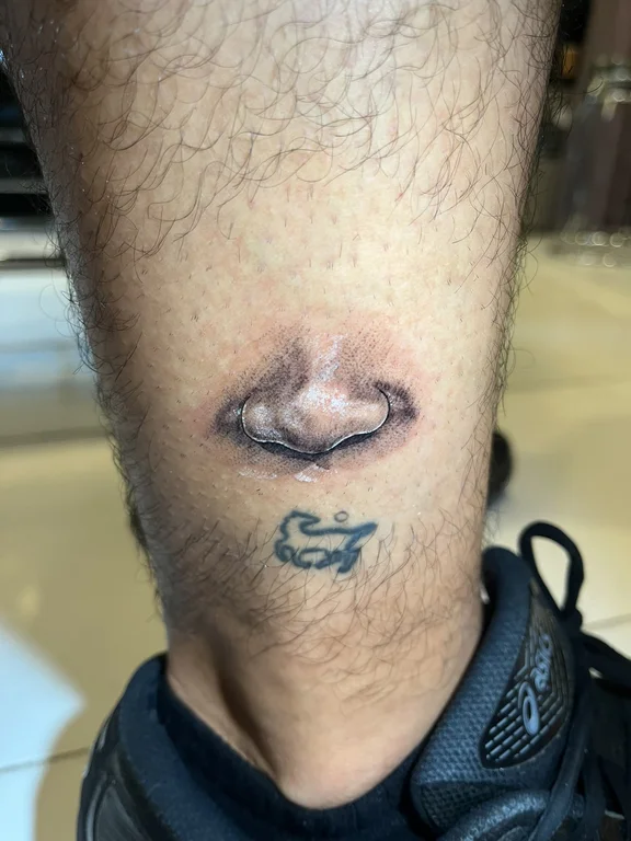 portrait realism face fine line cloud smoke snake heavy shading tattoo Canggu Bali