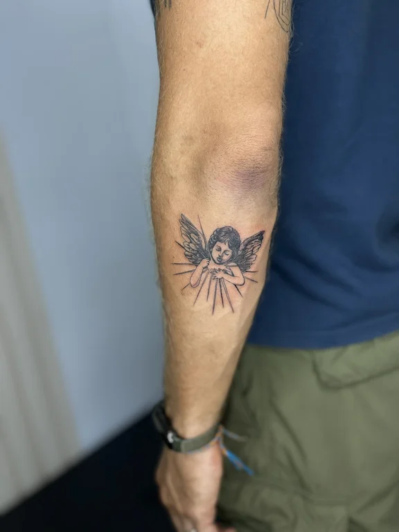 symbol realism angel black grey sun soft shading heavy shading dotwork tattoo Canggu Bali