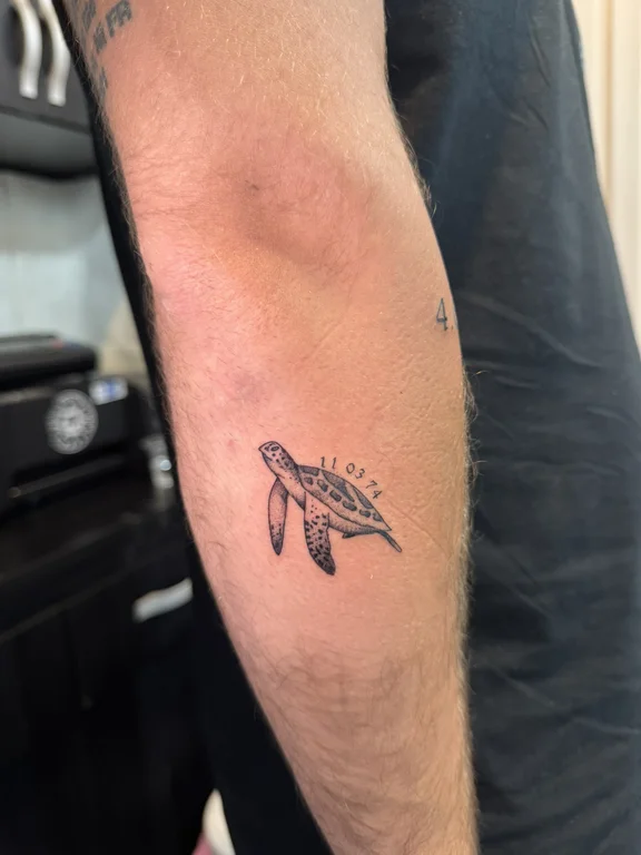 animal traditional koi fine line minimal linework dotwork black grey tattoo Canggu Bali