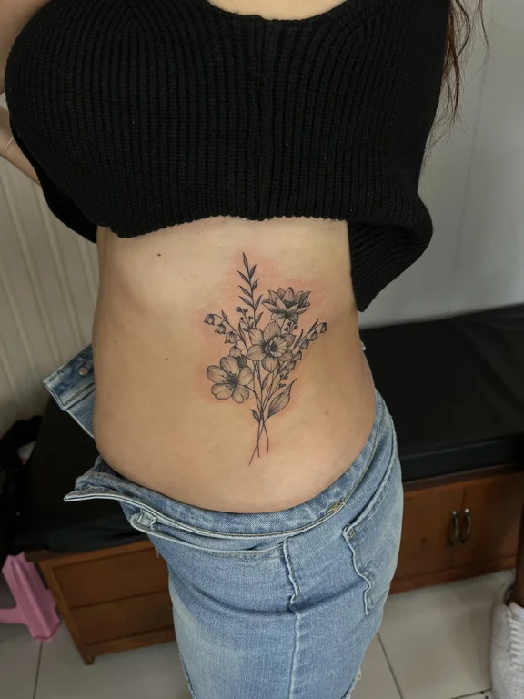 floral traditional peony soft shading leaf fine line linework elegant tattoo Canggu Bali