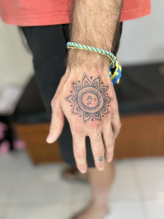 mandala traditional hand sacred geometry sun deity balinese pattern colorful tattoo Canggu Bali