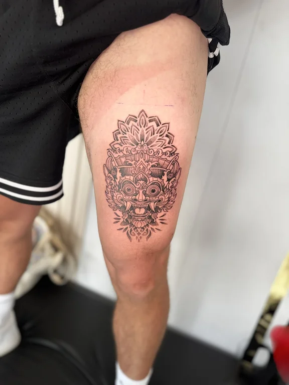 ornamental traditional deity dotwork sun linework mandala black grey tattoo Canggu Bali