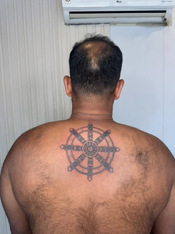 symbol traditional deity fine line sun linework black grey bold line tattoo Canggu Bali